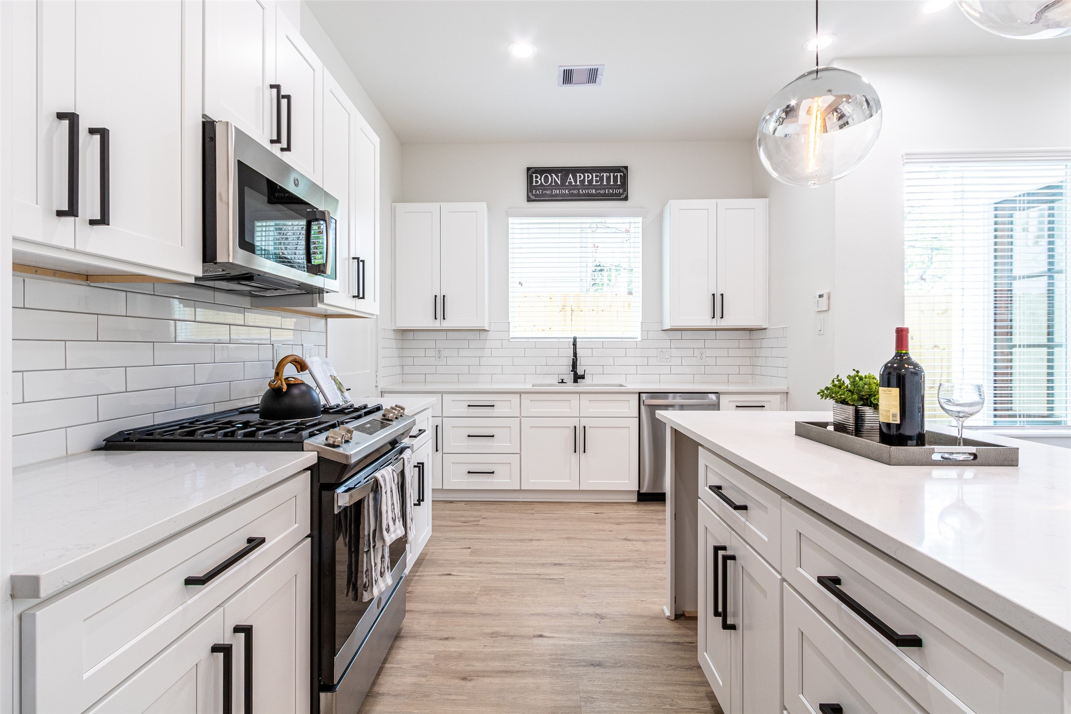 6814 Burkett Street, Unit B Houston, TX 77021 - Photo 13 of 30 a kitchen with stainless steel appliances granite countertop a sink stove and cabinets