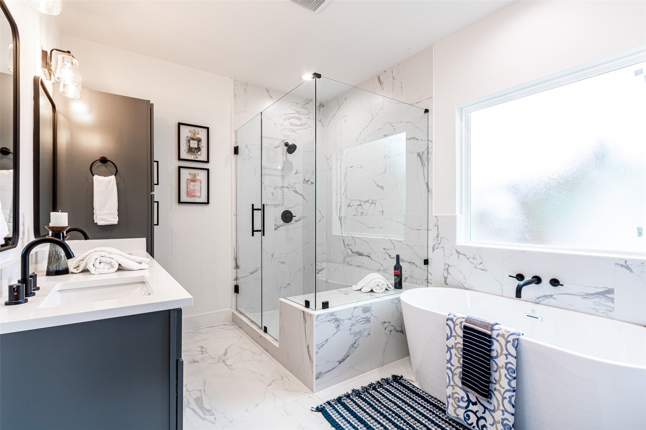 6814 Burkett Street, Unit B Houston, TX 77021 - Photo 17 of 30 a spacious bathroom with a double vanity sink mirror double and bathtub