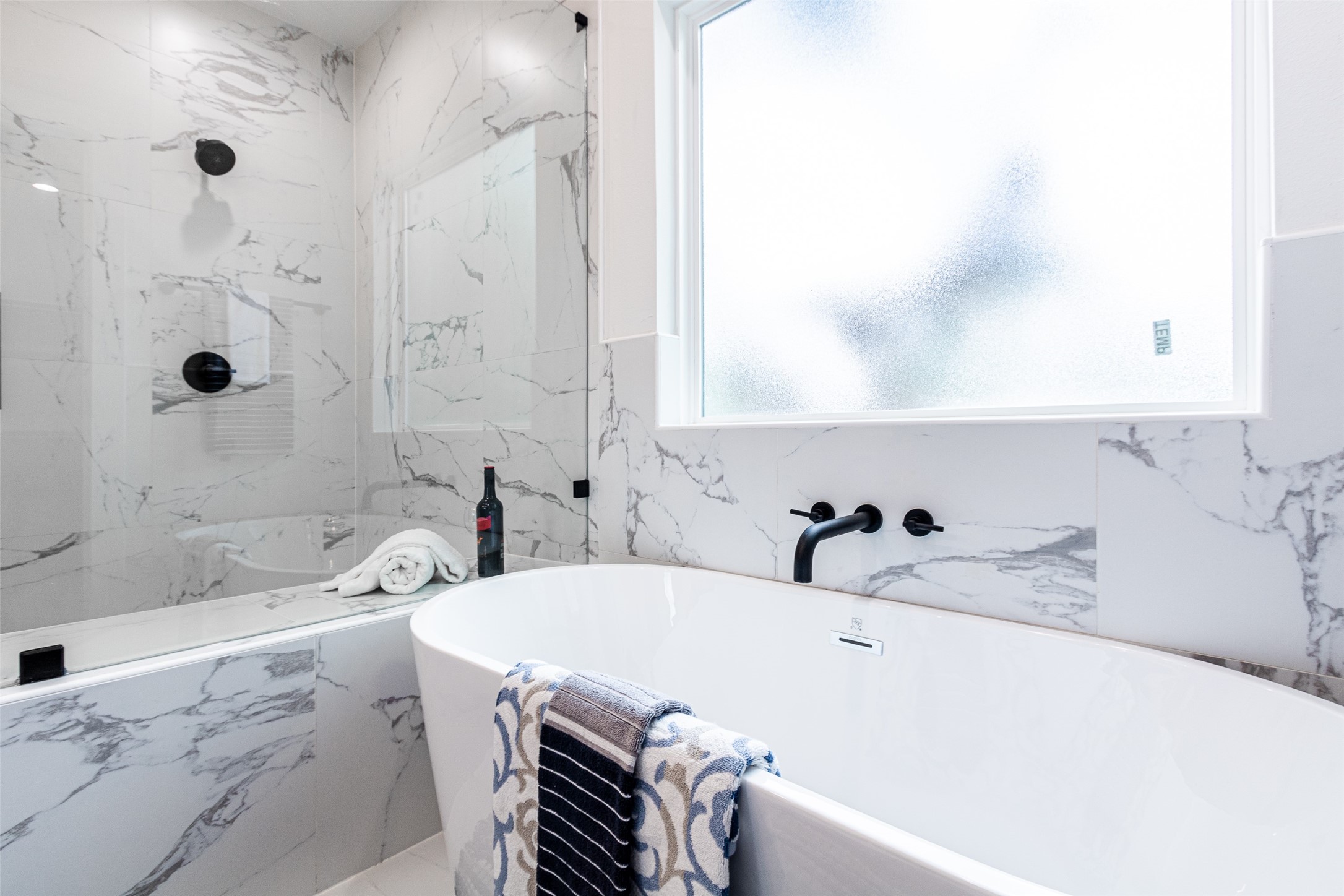 6814 Burkett Street, Unit B Houston, TX 77021 - Photo 19 of 30 a bathroom with a tub a sink and a shower