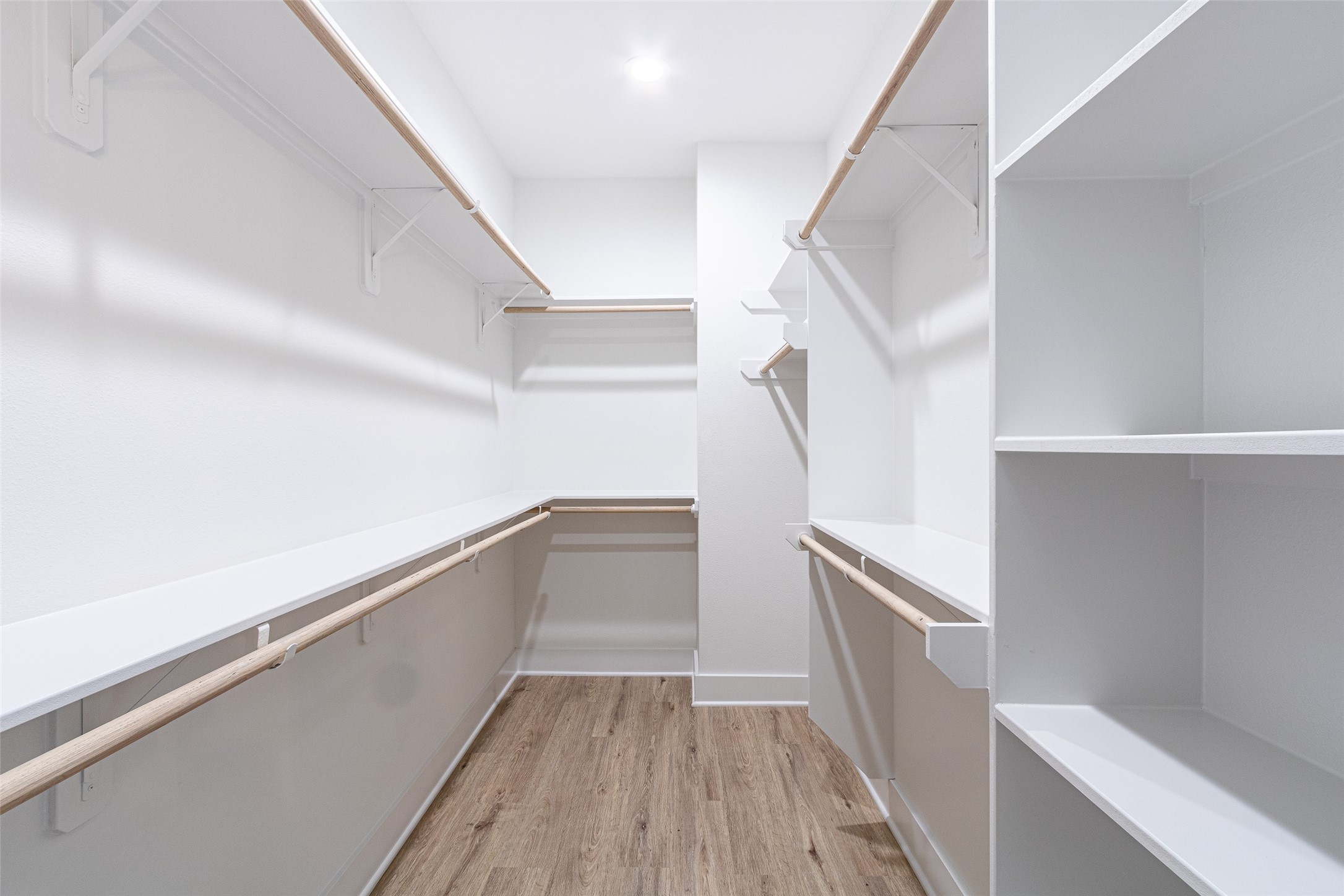 6814 Burkett Street, Unit B Houston, TX 77021 - Photo 21 of 30 a view of walk in closet with wooden floor