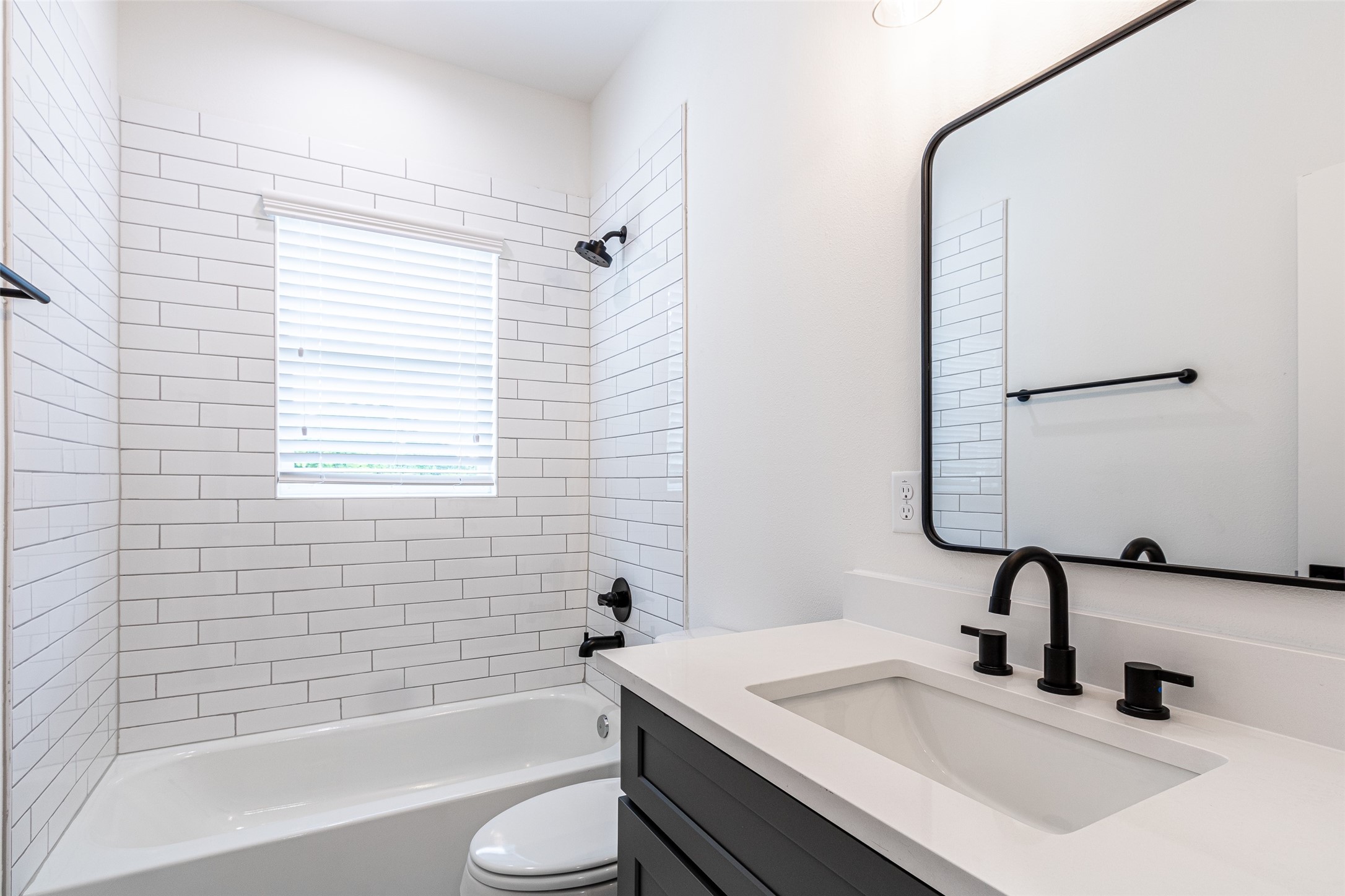 6814 Burkett Street, Unit B Houston, TX 77021 - Photo 24 of 30 a bathroom with a sink and a mirror