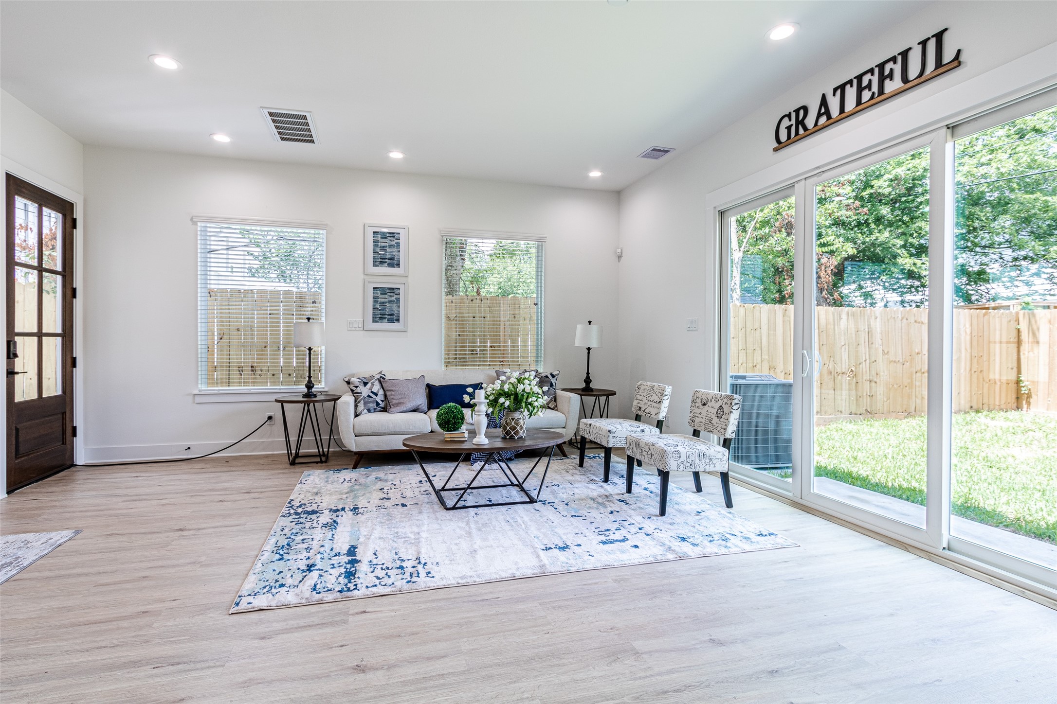 6814 Burkett Street, Unit B Houston, TX 77021 - Photo 6 of 30 a living room with furniture and a large window