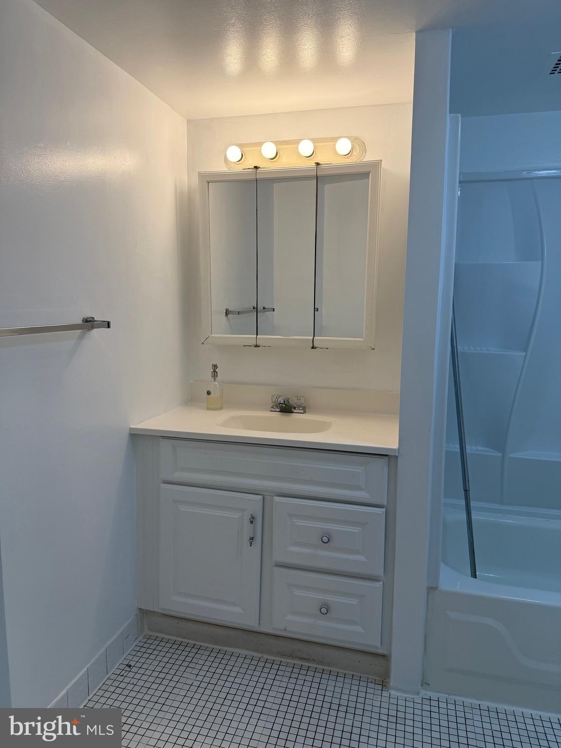 2059 Huntington Avenue, Unit 802 Alexandria, VA 22303 - Photo 8 of 18 a bathroom with a sink and a mirror