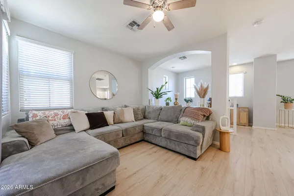 a living room with furniture and a large window