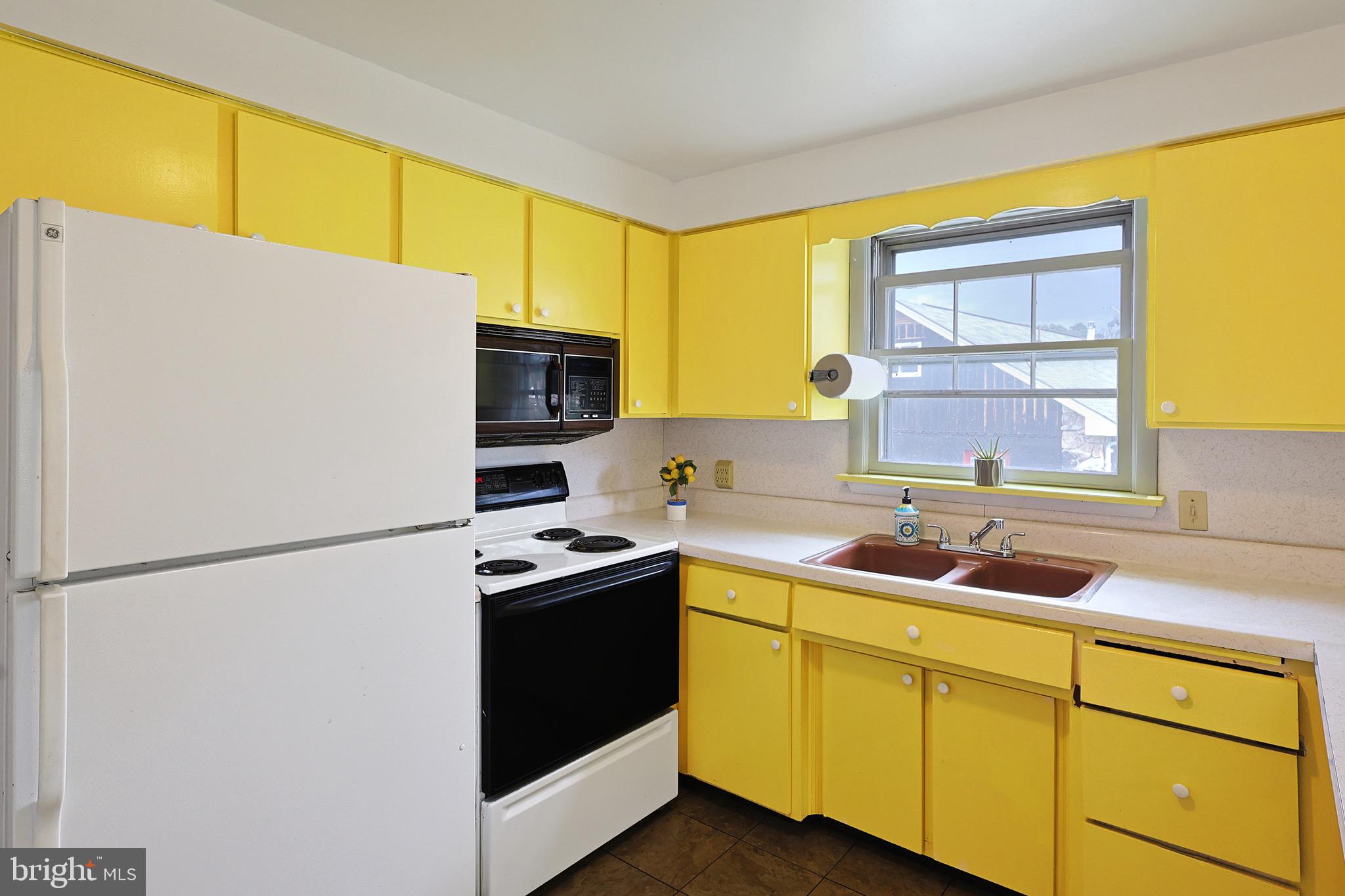 159 Rocket Center Road Keyser, WV 26726 - Photo 21 of 64 a kitchen with a sink a refrigerator and window