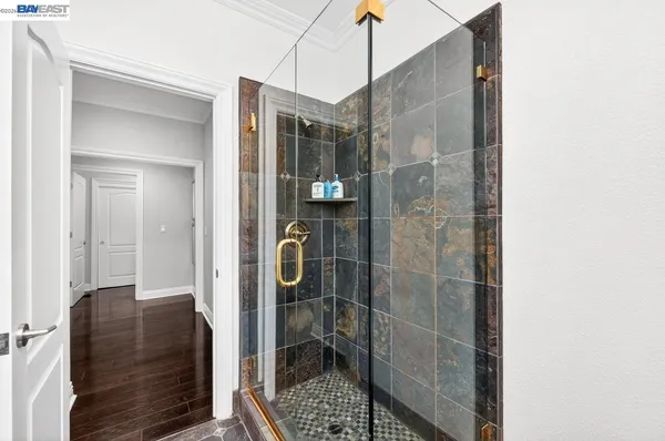 a bathroom with a shower and a sink