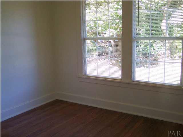 5384 Mulat Road Milton, FL 32583 - Photo 13 of 22 Master bedroom with hardwood floors and new windows.