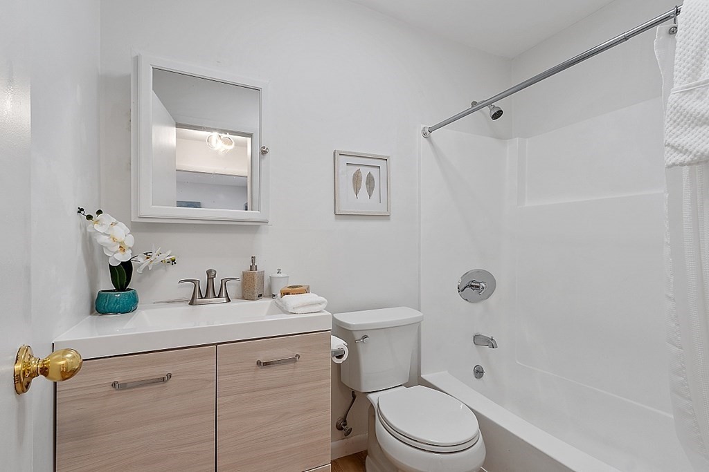 6 Leonard Road, Unit 6 Boxborough, MA 01719 - Photo 14 of 28 a bathroom with a sink a toilet and shower