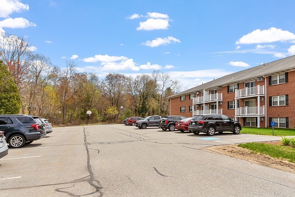 6 Leonard Road, Unit 6 Boxborough, MA 01719 - Photo 24 of 28 a cars parked in front of a house