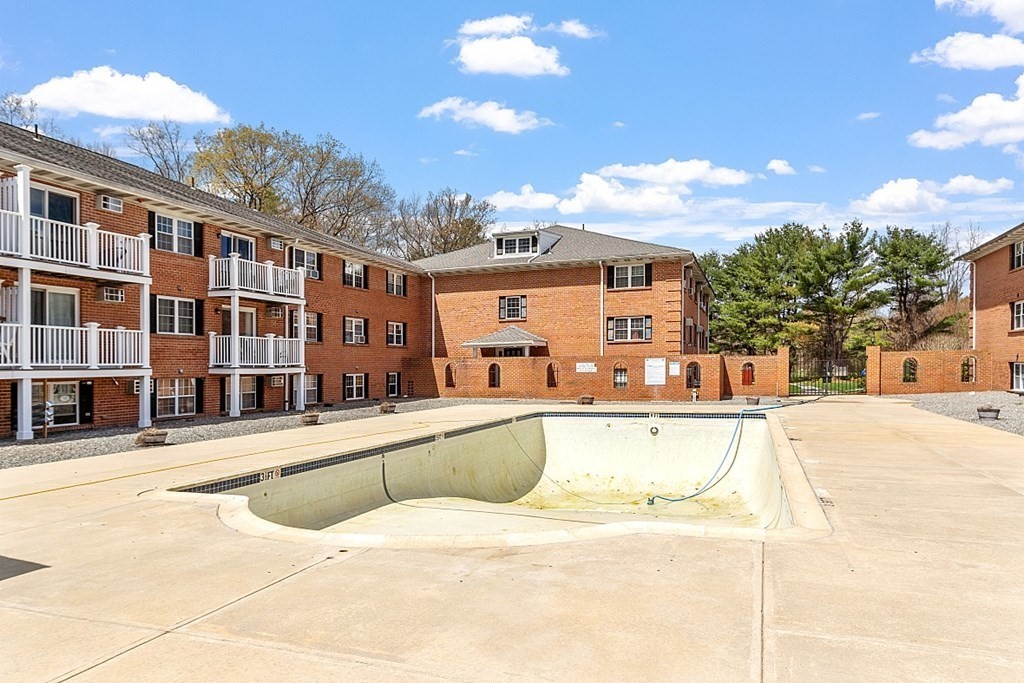 6 Leonard Road, Unit 6 Boxborough, MA 01719 - Photo 25 of 28 a view of a building with a swimming pool