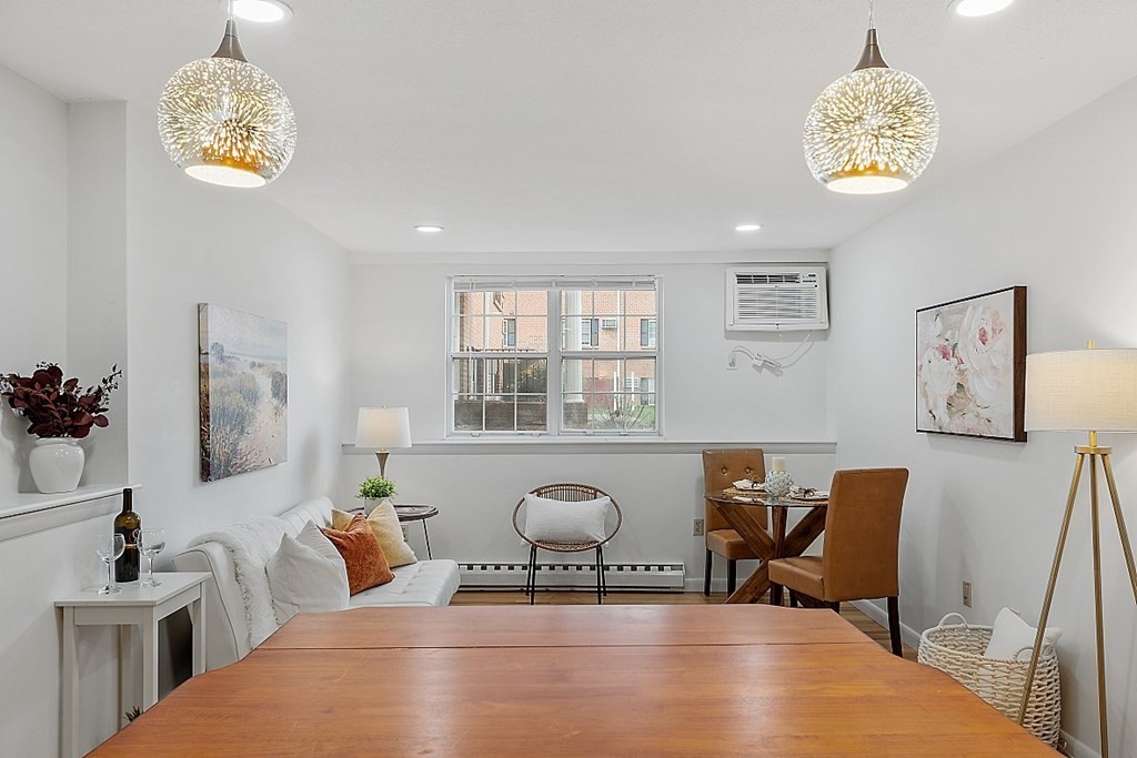 6 Leonard Road, Unit 6 Boxborough, MA 01719 - Photo 10 of 28 a view of a workspace with furniture and a chandelier