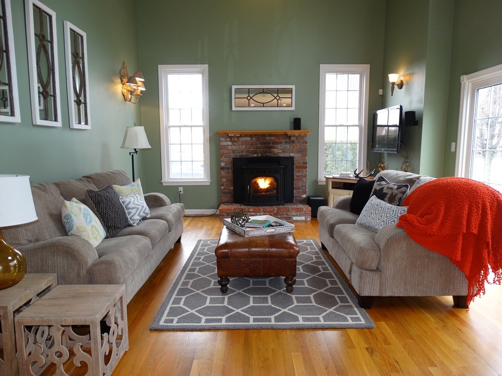 73 Hardwick Road Ashland, MA 01721 - Photo 8 of 30 a living room with furniture and a fireplace