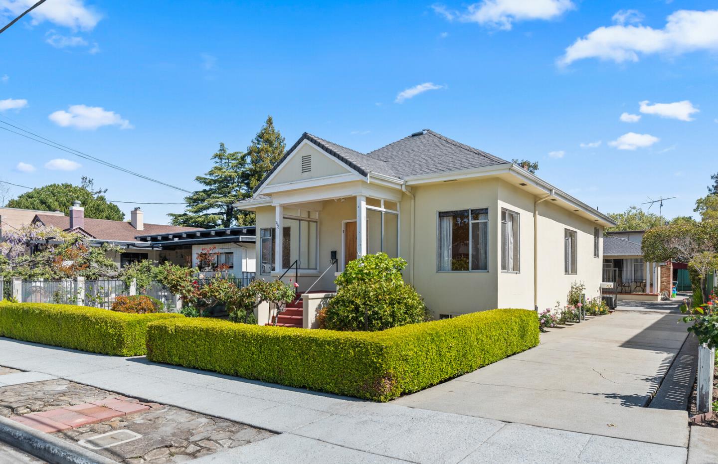 716 Prospect Row San Mateo, CA 94401 - Photo 1 of 39 a front view of a house with a garden