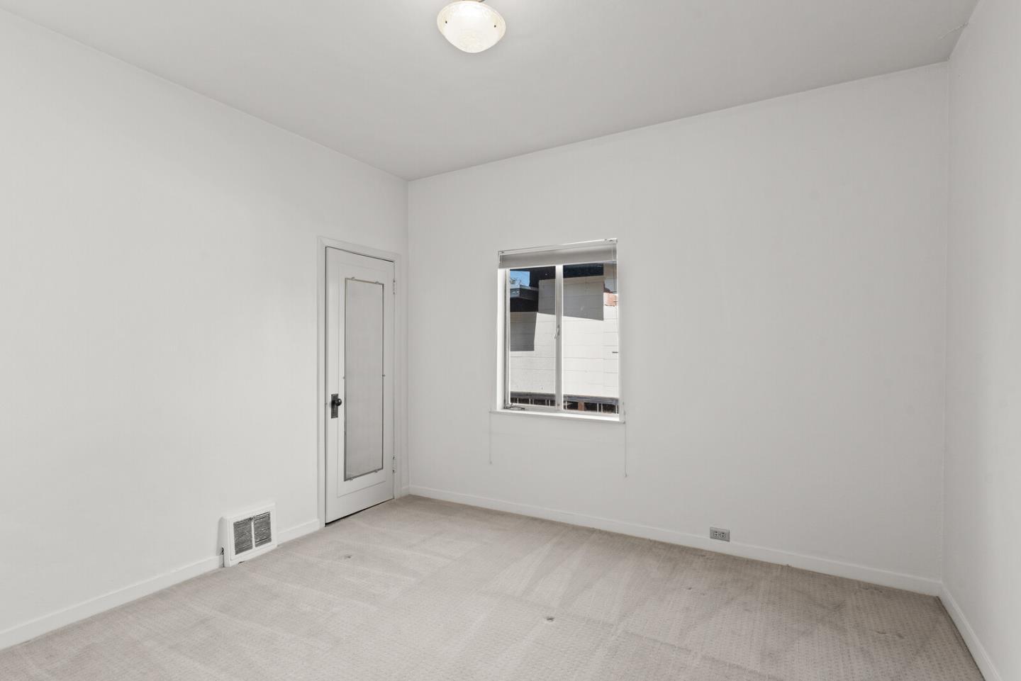 716 Prospect Row San Mateo, CA 94401 - Photo 11 of 39 an empty room with a window