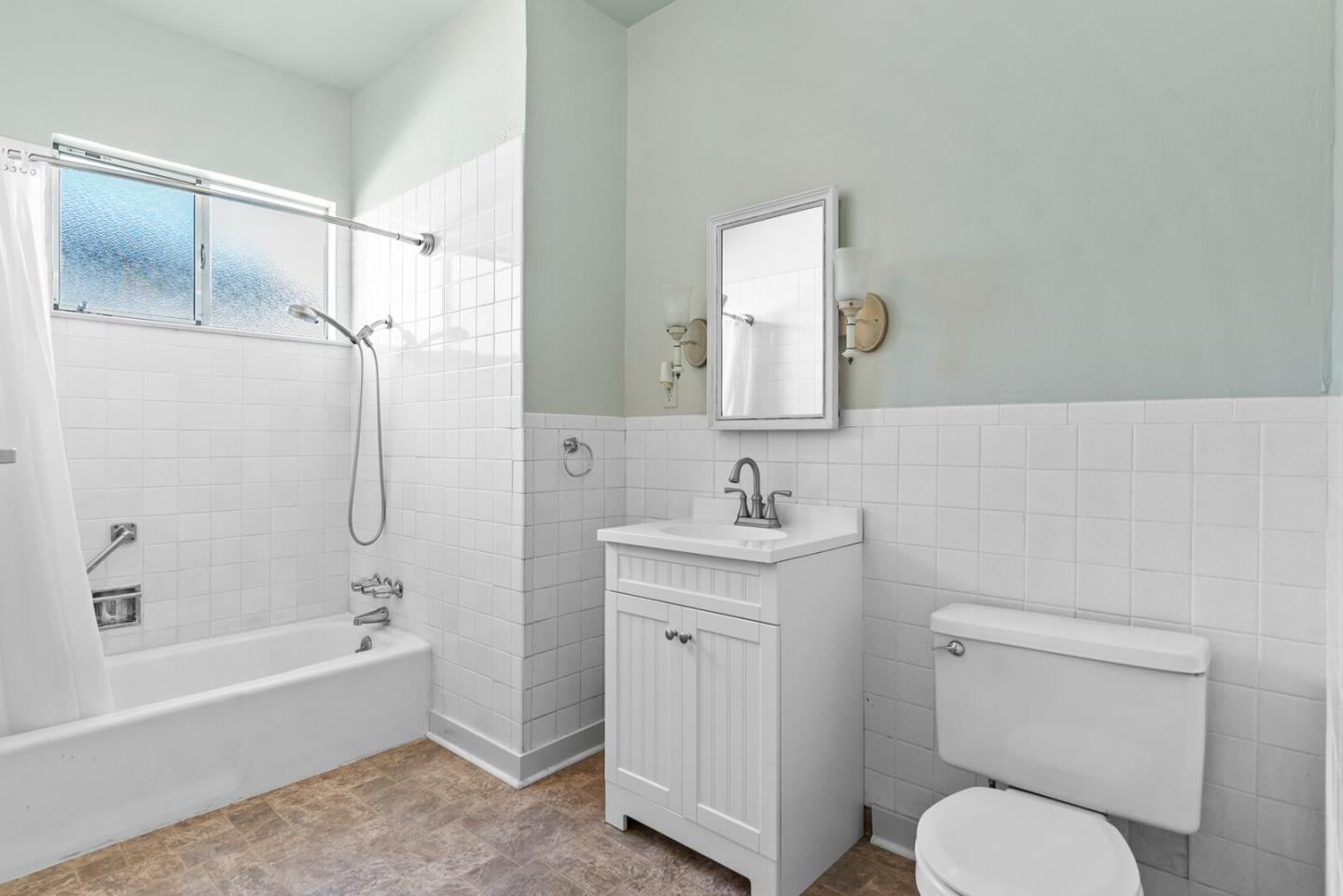716 Prospect Row San Mateo, CA 94401 - Photo 12 of 39 a bathroom with a granite countertop toilet sink and shower