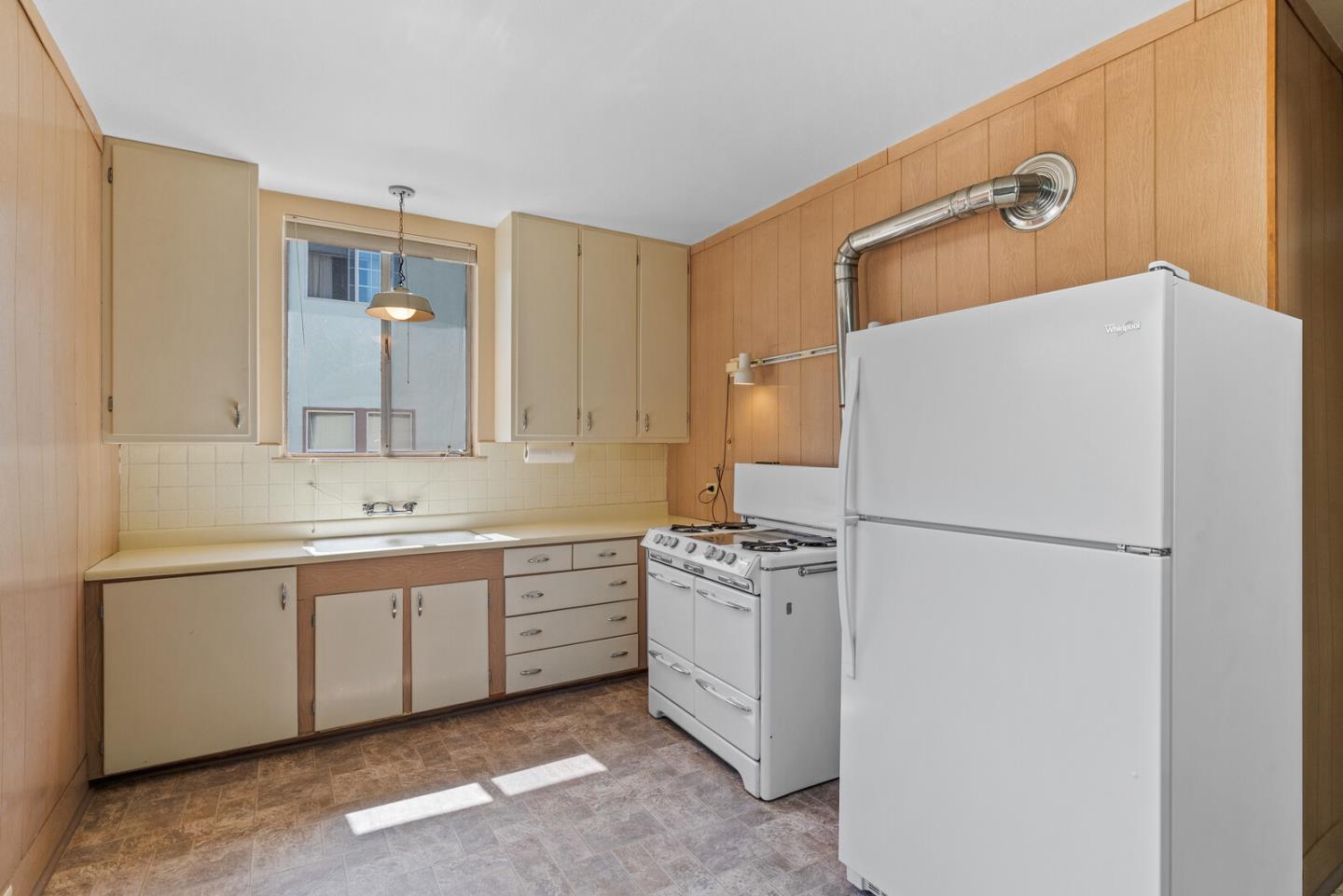 716 Prospect Row San Mateo, CA 94401 - Photo 15 of 39 a white refrigerator freezer sitting inside of a kitchen