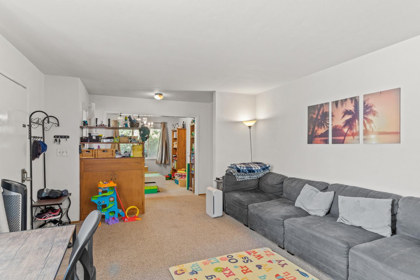 716 Prospect Row San Mateo, CA 94401 - Photo 18 of 39 a living room with furniture and a couch