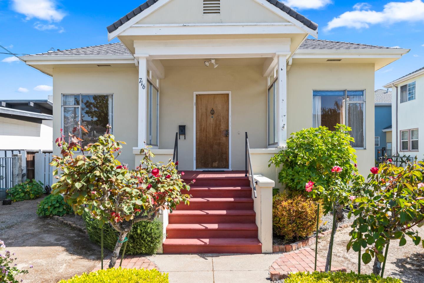 716 Prospect Row San Mateo, CA 94401 - Photo 2 of 39 a front view of a house with a yard