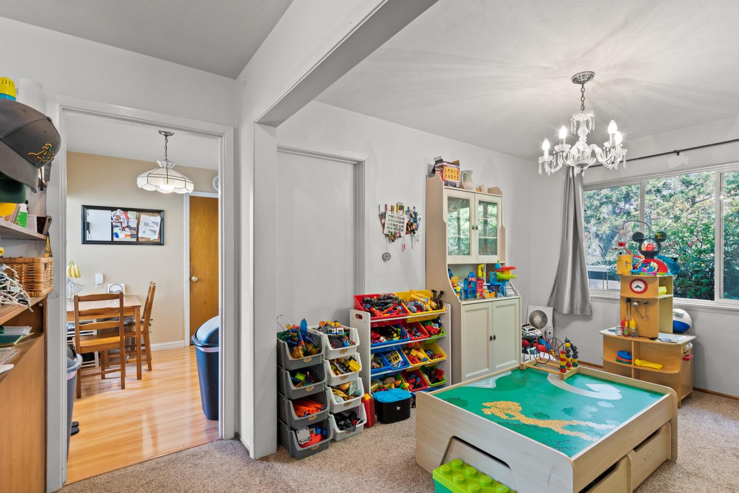 716 Prospect Row San Mateo, CA 94401 - Photo 21 of 39 a room with toys and a chandelier