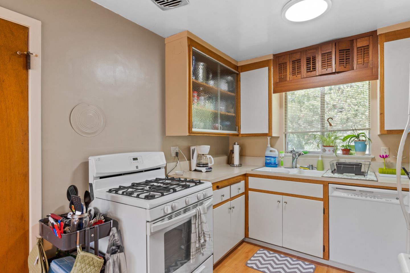716 Prospect Row San Mateo, CA 94401 - Photo 24 of 39 a kitchen that has a sink and a stove