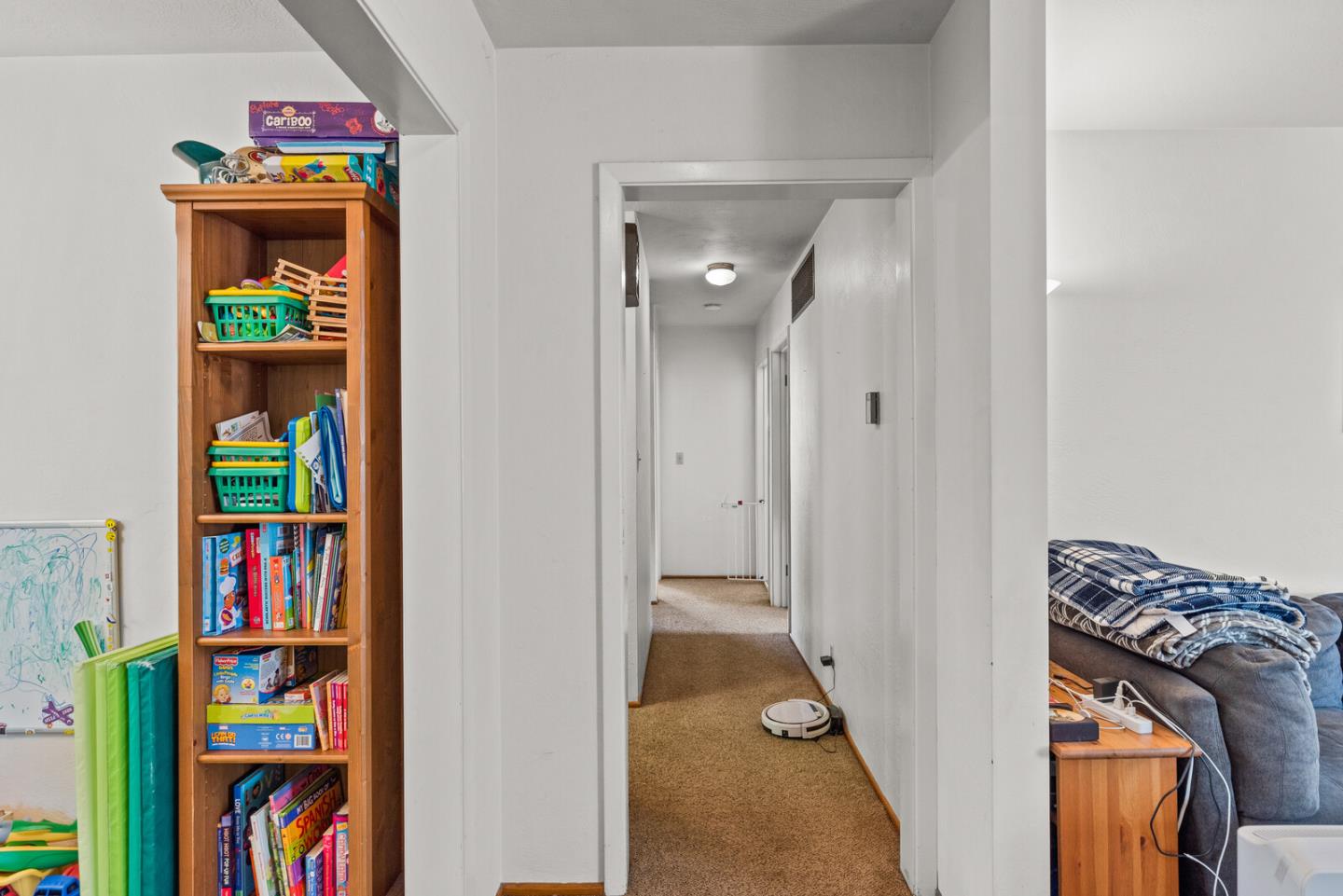 716 Prospect Row San Mateo, CA 94401 - Photo 27 of 39 a view of kids bedroom with a bed and a book shelf