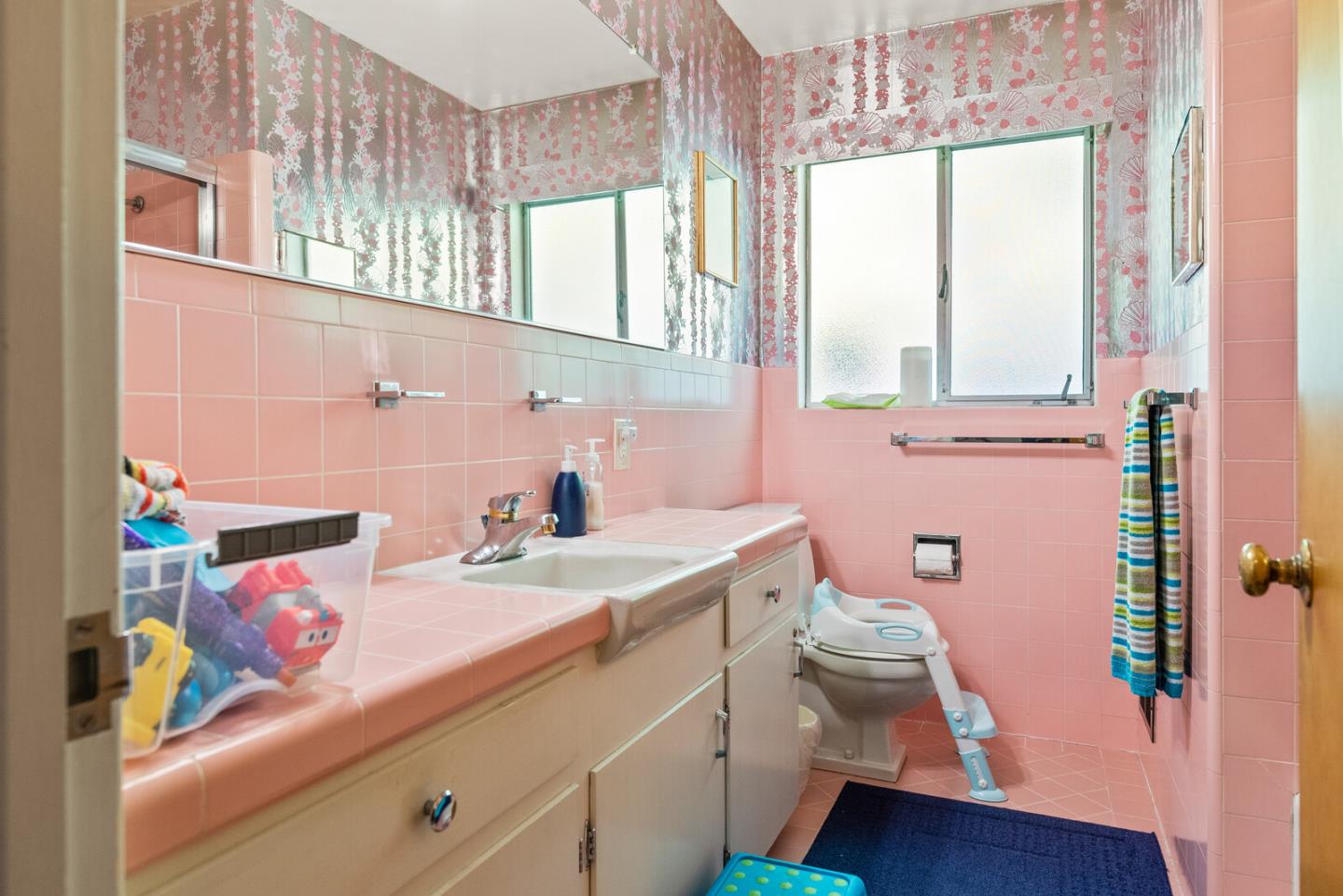 716 Prospect Row San Mateo, CA 94401 - Photo 28 of 39 a bathroom with a sink a toilet and a window