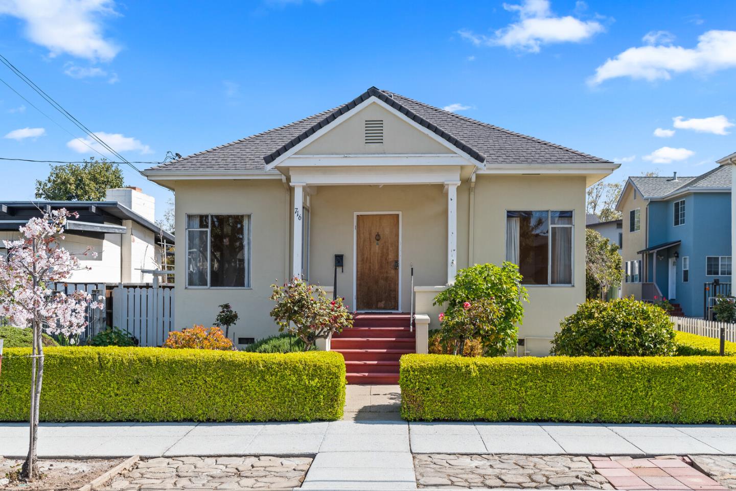 716 Prospect Row San Mateo, CA 94401 - Photo 3 of 39 a front view of a house with a garden