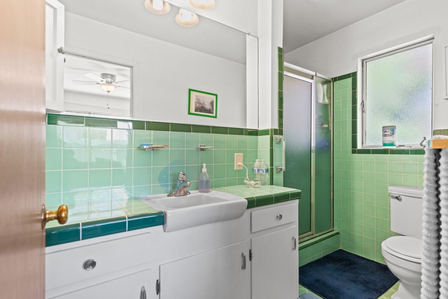716 Prospect Row San Mateo, CA 94401 - Photo 33 of 39 a bathroom with a sink a toilet and a shower