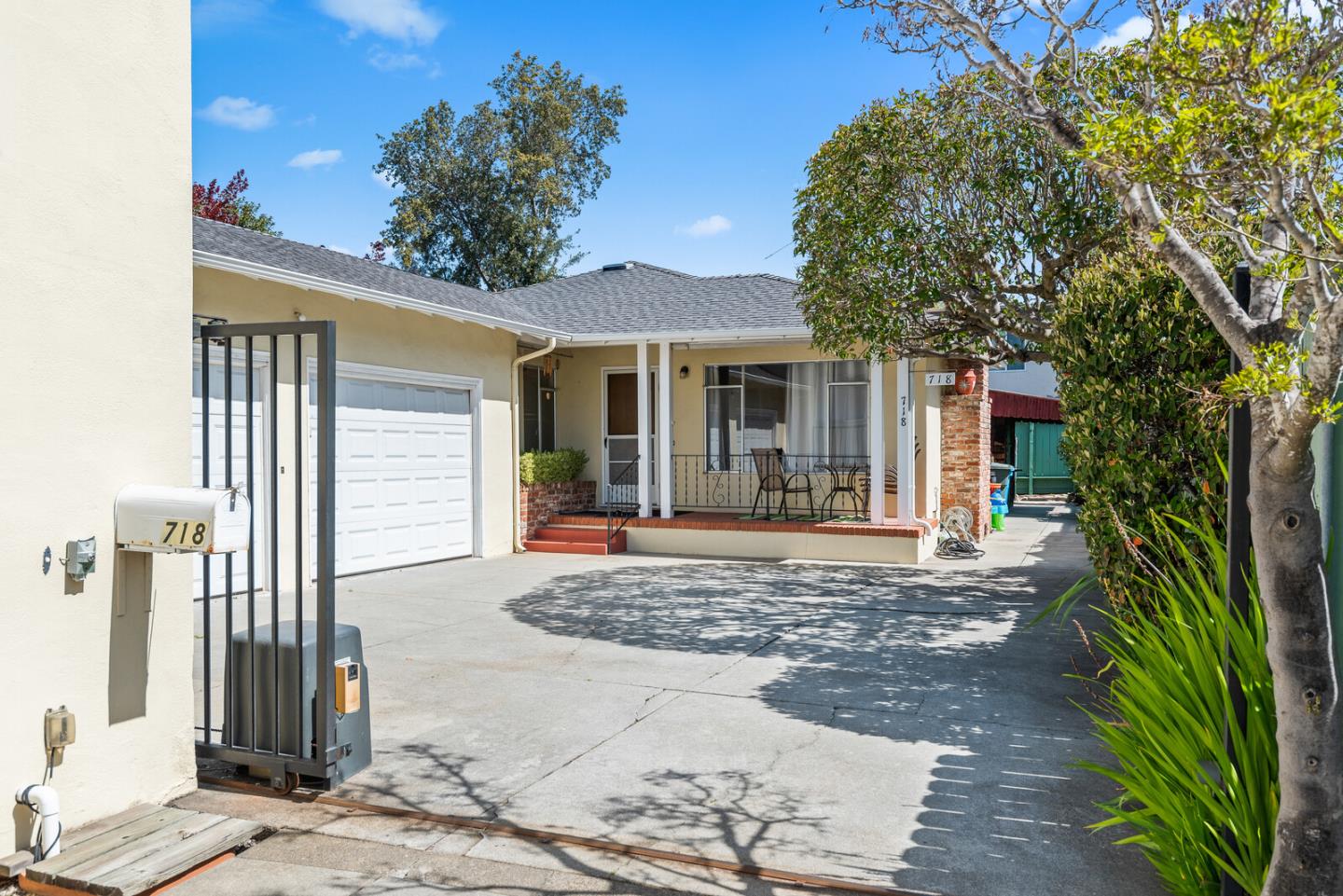 716 Prospect Row San Mateo, CA 94401 - Photo 37 of 39 a view of a house with a tree in front of it