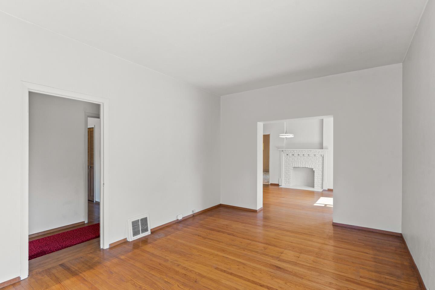 716 Prospect Row San Mateo, CA 94401 - Photo 6 of 39 a view of an empty room and wooden floor