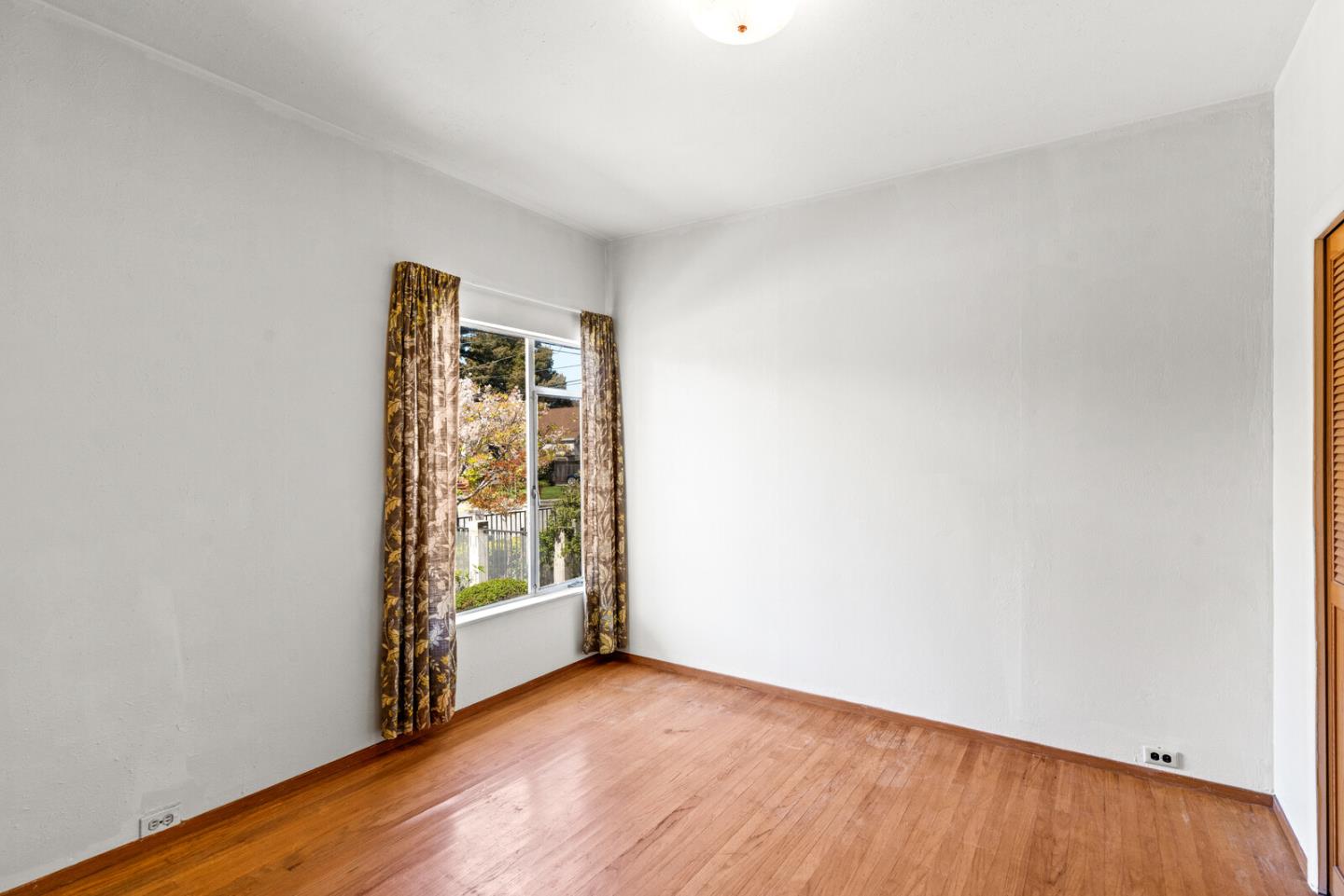 716 Prospect Row San Mateo, CA 94401 - Photo 10 of 39 a view of an empty room with a window