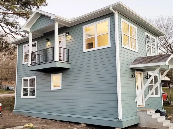 a front view of a house with a balcony