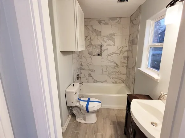 a bathroom with a sink and a bathtub
