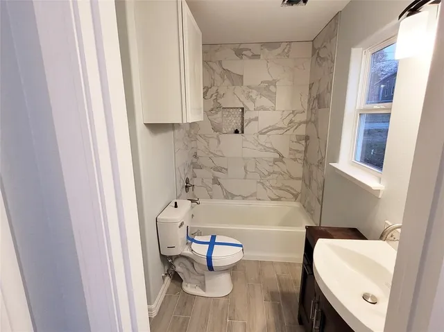 a bathroom with a sink and a bathtub