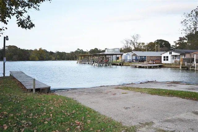 a view of a lake with houses with outdoor space