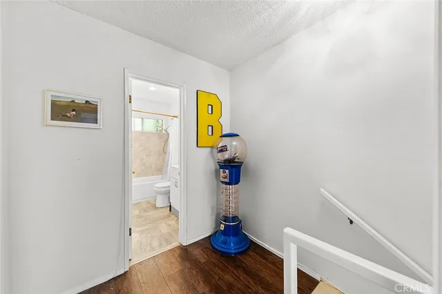 a view of walk in closet with wooden floor