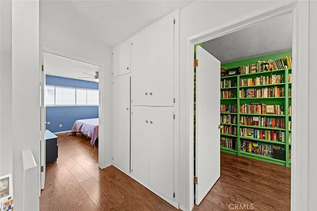 a view of bedroom with a bed and a book shelf