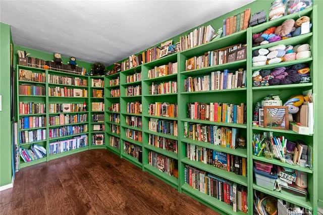 a view of room with bookshelf book shelves