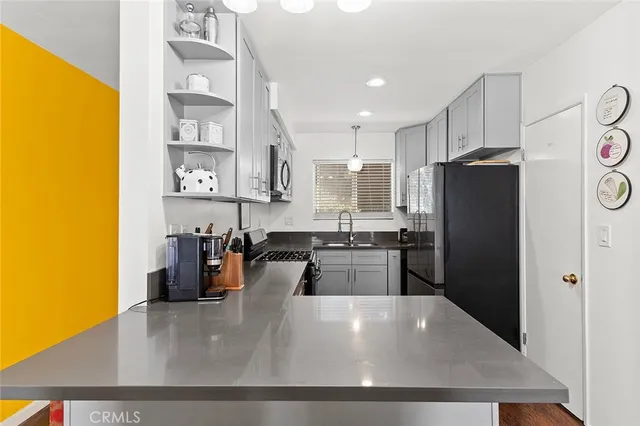 a large refrigerator with wooden floor