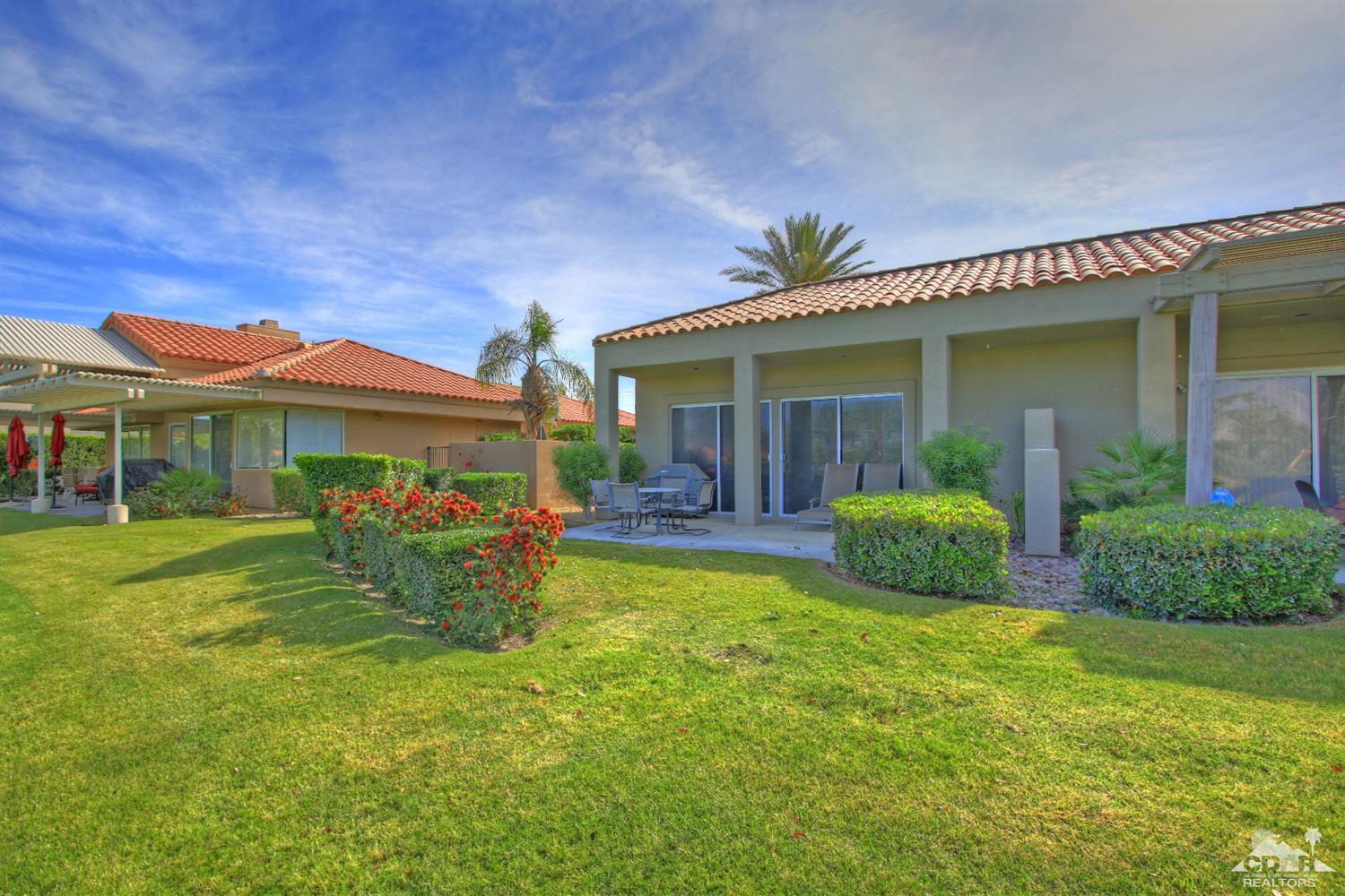 a view of a house with garden and porch