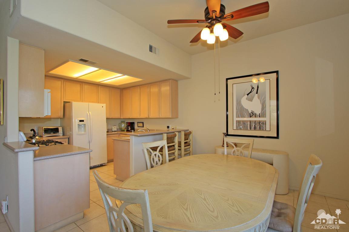 15 Augusta Drive Rancho Mirage, CA 92270 - Photo 13 of 35 a living room with stainless steel appliances furniture a dining table and a chandelier