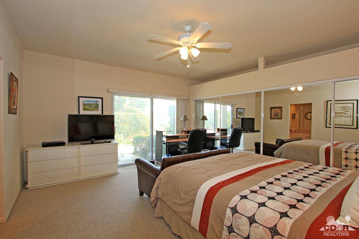 15 Augusta Drive Rancho Mirage, CA 92270 - Photo 16 of 35 a bedroom with double bed and a flat screen tv
