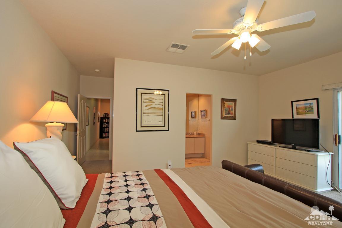 15 Augusta Drive Rancho Mirage, CA 92270 - Photo 18 of 35 a bedroom with a bed and a flat screen tv