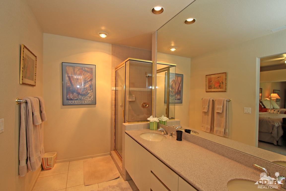 15 Augusta Drive Rancho Mirage, CA 92270 - Photo 19 of 35 a spacious bathroom with a double vanity sink a mirror and a shower