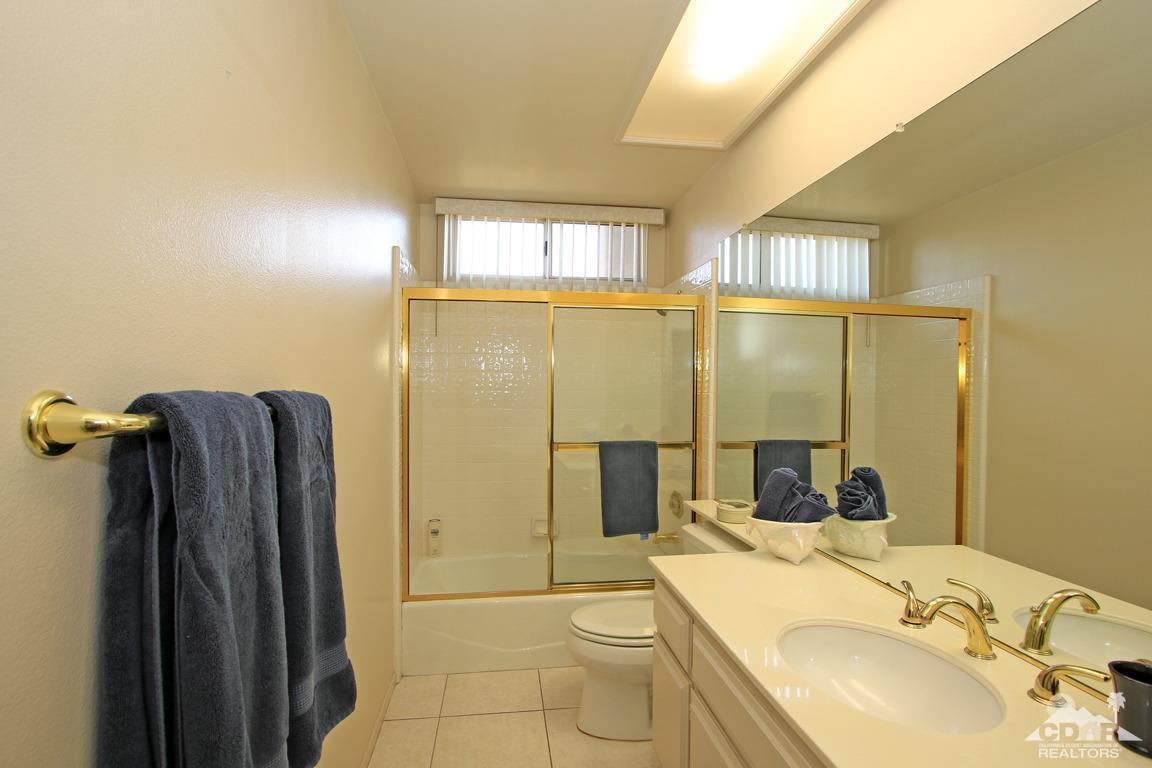 15 Augusta Drive Rancho Mirage, CA 92270 - Photo 21 of 35 a bathroom with a sink toilet and shower