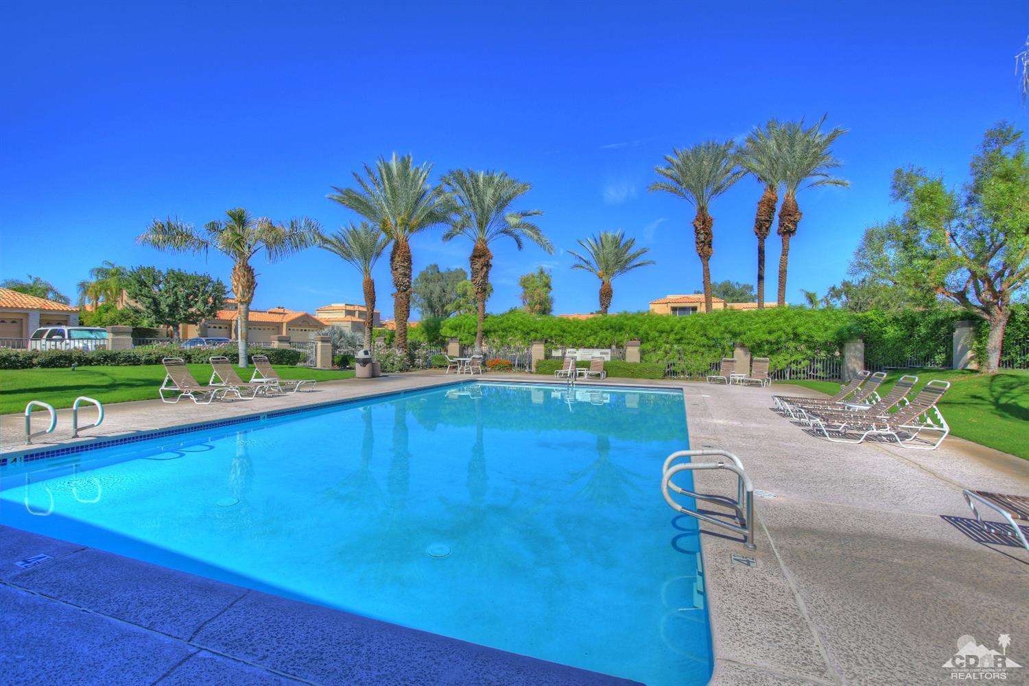 15 Augusta Drive Rancho Mirage, CA 92270 - Photo 33 of 35 a view of a swimming pool and trees in the background