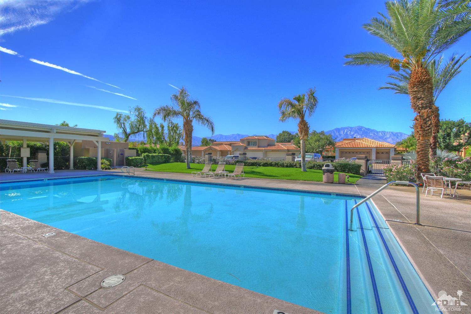 15 Augusta Drive Rancho Mirage, CA 92270 - Photo 34 of 35 a view of swimming pool with a yard and sitting area