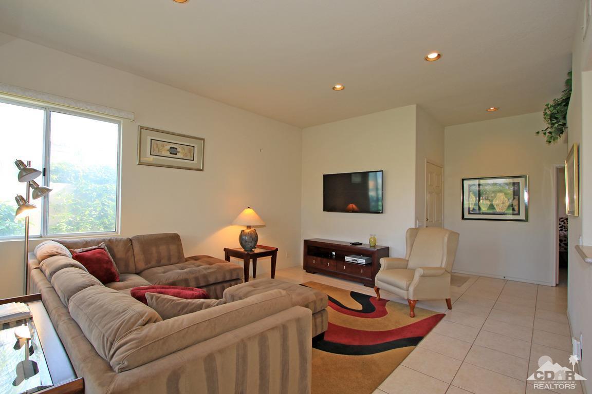 15 Augusta Drive Rancho Mirage, CA 92270 - Photo 6 of 35 a living room with furniture a rug and a window