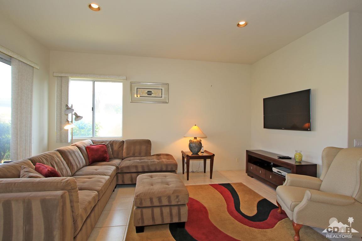 15 Augusta Drive Rancho Mirage, CA 92270 - Photo 9 of 35 a living room with furniture fireplace and a window