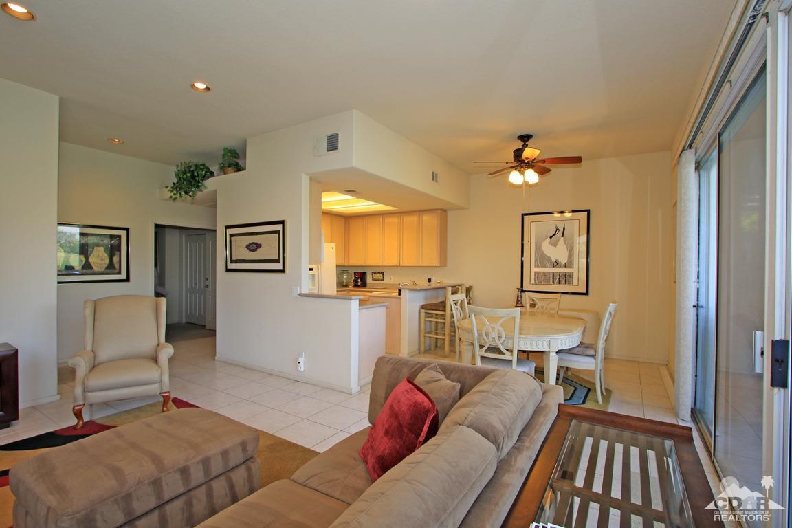 15 Augusta Drive Rancho Mirage, CA 92270 - Photo 10 of 35 a living room with furniture and a chandelier